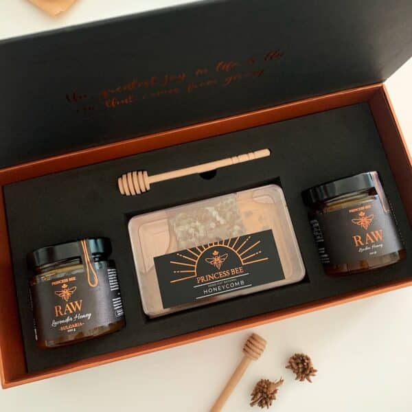 open gift box Honeycomb showing two jars of honey and a box of honeycomb