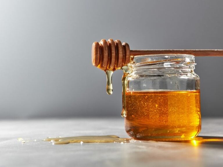 Tasting palette with multiple raw honey samples showing colour and texture differences